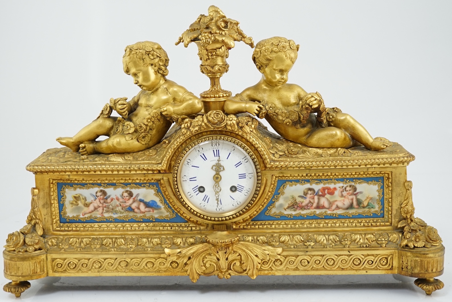 A 19th century French ormolu and Sevres style porcelain mantel clock